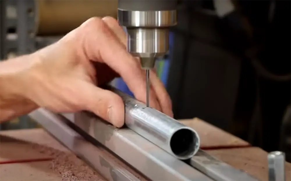 Drill holes into the top of the pipes